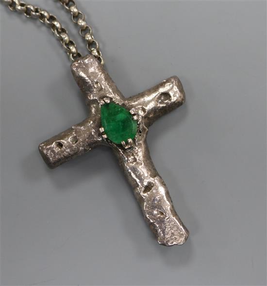 A 1970s white metal and emerald set cross pendant, on a silver belcher link chain, pendant 65mm.